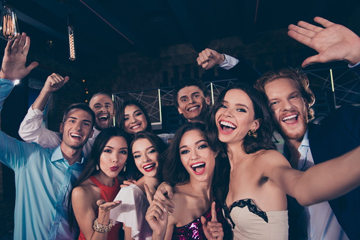 Teen students pose together for a prom photo