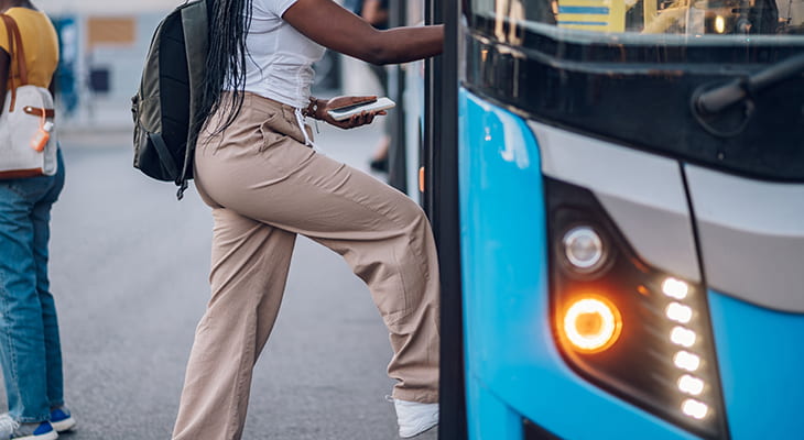 A commuters enters a bus rental