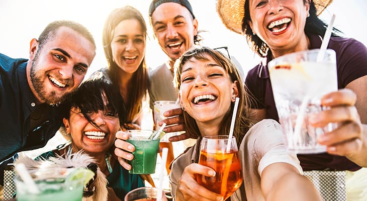 Party attendees toast drinks at a special event