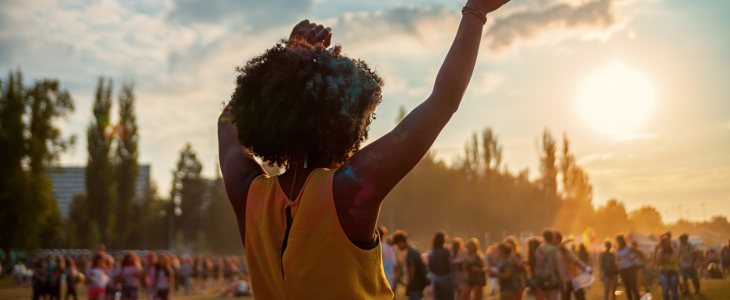 a girl crowd surfing at a show